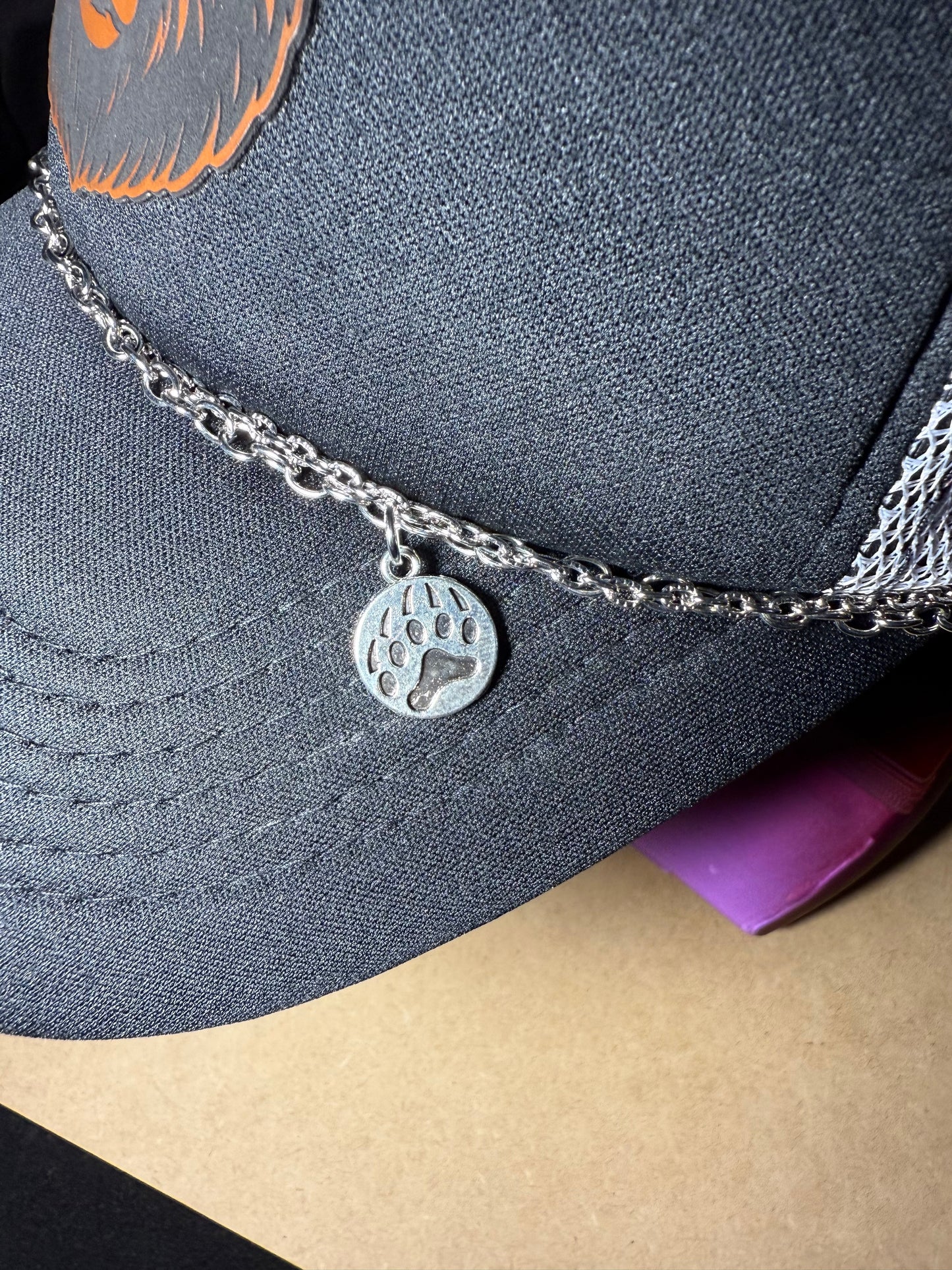 Mama Bear Patch trucker hat with chain and charms.