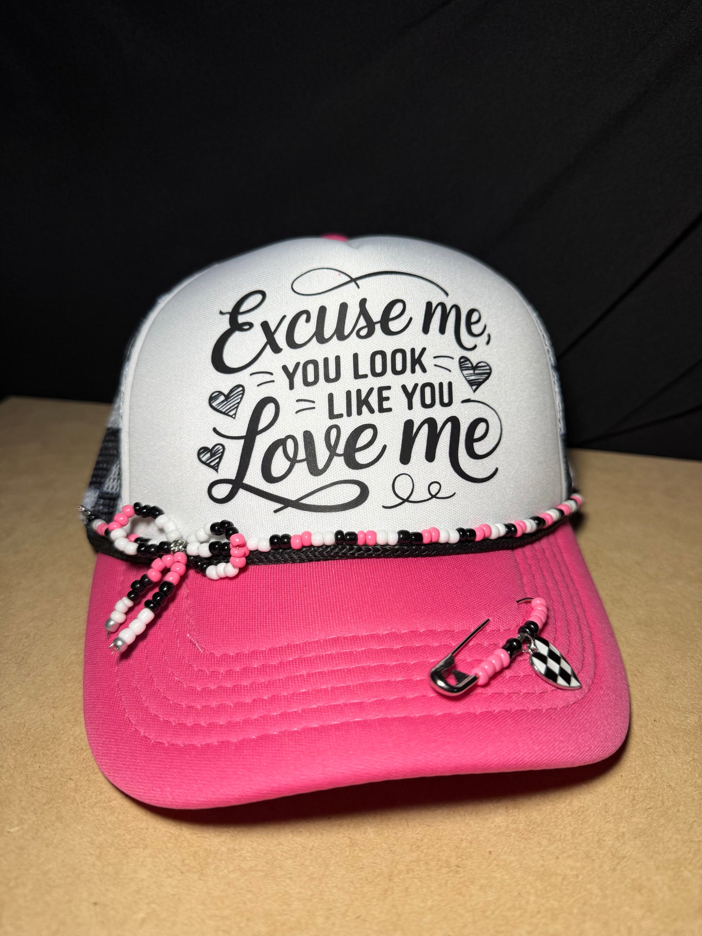 Excuse me, you look like you love me. Checkered adjustable back with white foam front. Adorable!