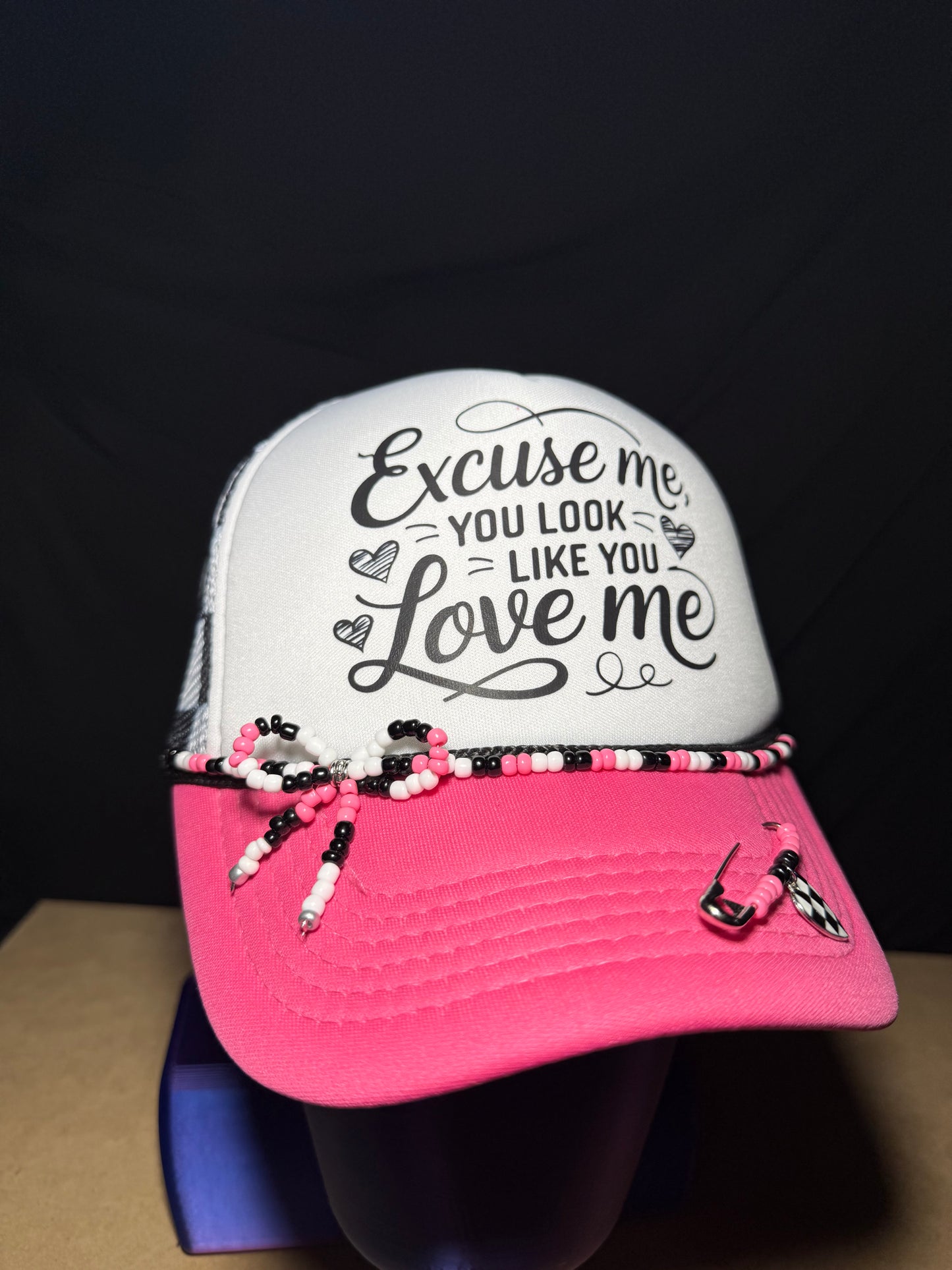Excuse me, you look like you love me. Checkered adjustable back with white foam front. Adorable!