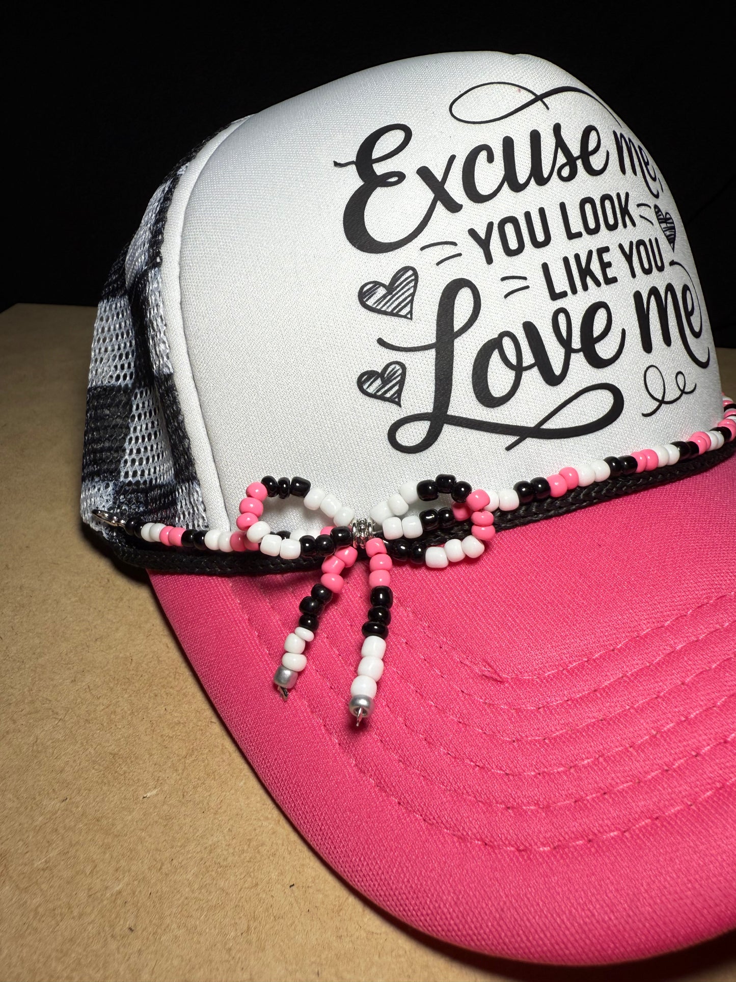 Excuse me, you look like you love me. Checkered adjustable back with white foam front. Adorable!