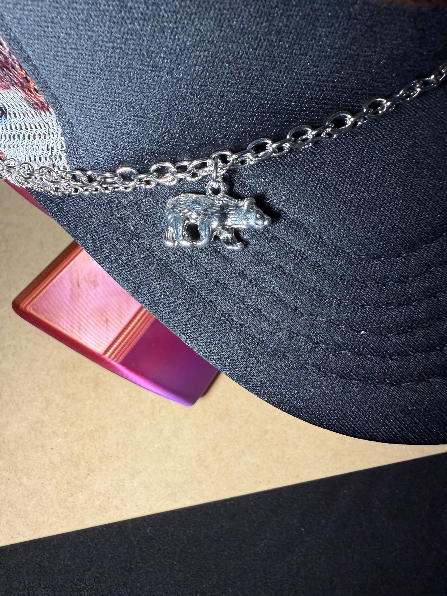 Mama Bear Patch trucker hat with chain and charms.